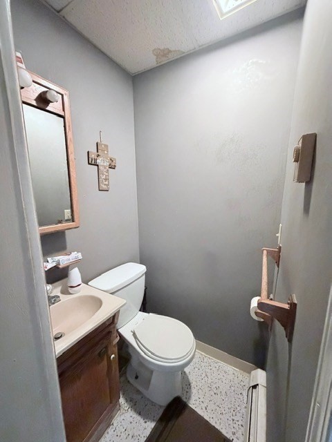 47 Acton Street Worcester, MA 01604 - Photo 19 of 30 a white toilet sitting next to a bathroom sink