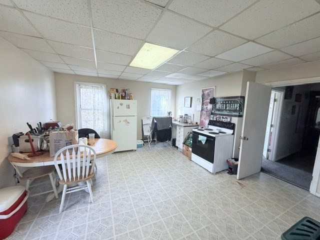 47 Acton Street Worcester, MA 01604 - Photo 22 of 30 a living room with furniture and a dining table