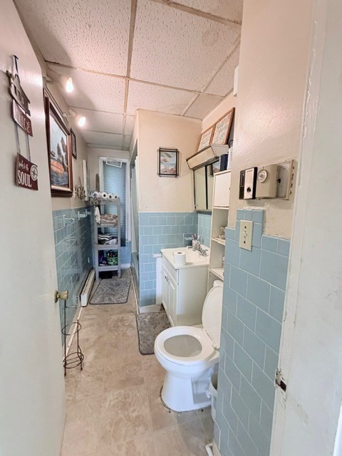 47 Acton Street Worcester, MA 01604 - Photo 23 of 30 a bathroom with a toilet sink and mirror