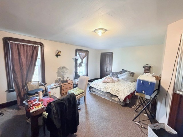 47 Acton Street Worcester, MA 01604 - Photo 25 of 30 a living room with furniture a fireplace and a window