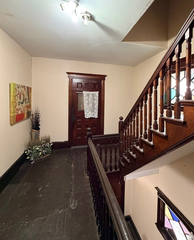 47 Acton Street Worcester, MA 01604 - Photo 10 of 30 a view of an entryway wooden floor and stairs