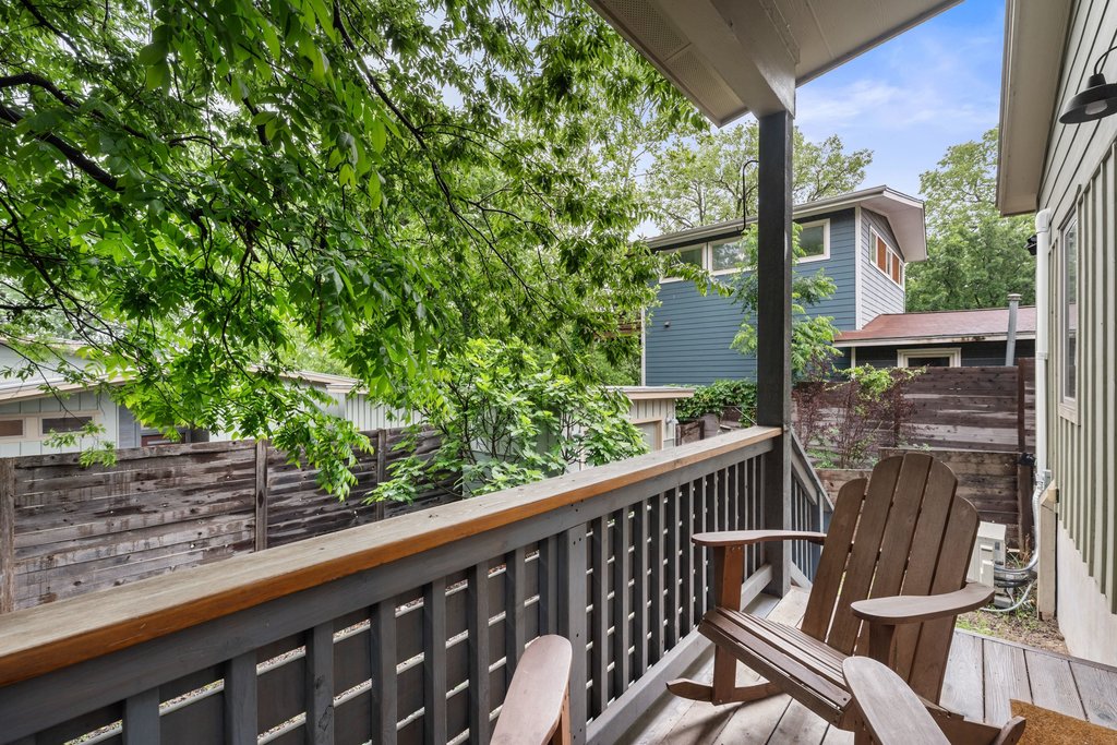 1131 Poquito Street, Unit A Austin, TX 78702 - Photo 19 of 34 a view of a balcony with wooden floor