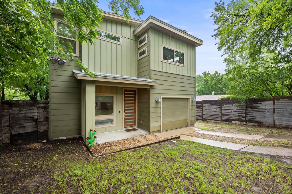 1131 Poquito Street, Unit A Austin, TX 78702 - Photo 2 of 34 a view of a house with a small yard and large tree