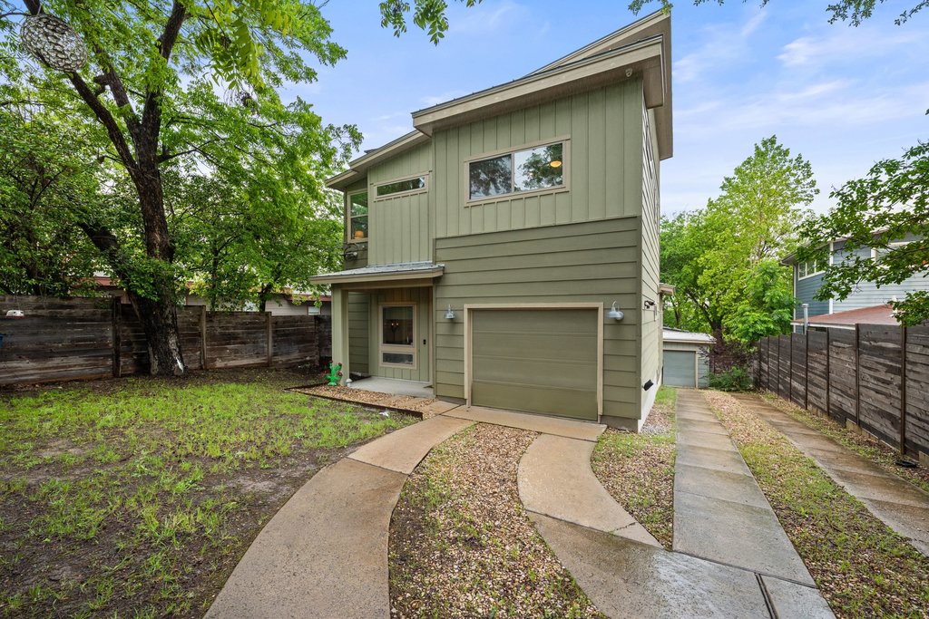 1131 Poquito Street, Unit A Austin, TX 78702 - Photo 3 of 34 a front view of a house with a yard