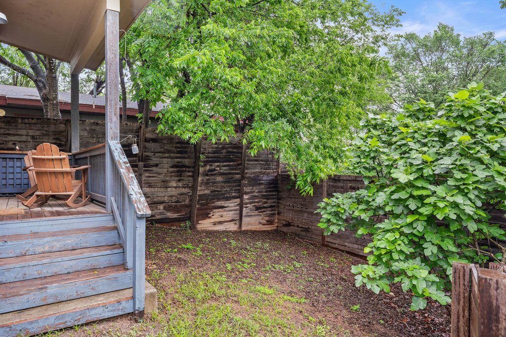 1131 Poquito Street, Unit A Austin, TX 78702 - Photo 31 of 34 a backyard of a house with lots of green space