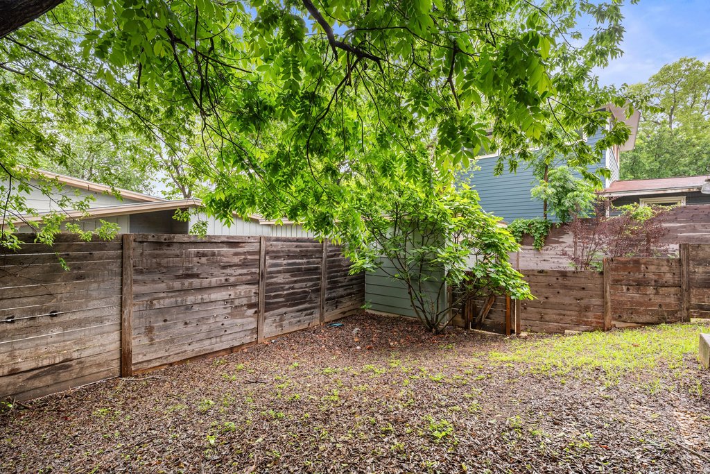 1131 Poquito Street, Unit A Austin, TX 78702 - Photo 34 of 34 a backyard of a house with lots of green space