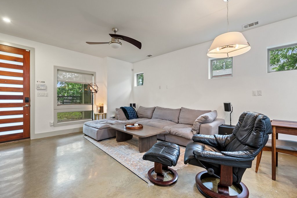 1131 Poquito Street, Unit A Austin, TX 78702 - Photo 5 of 34 a living room with furniture and a window