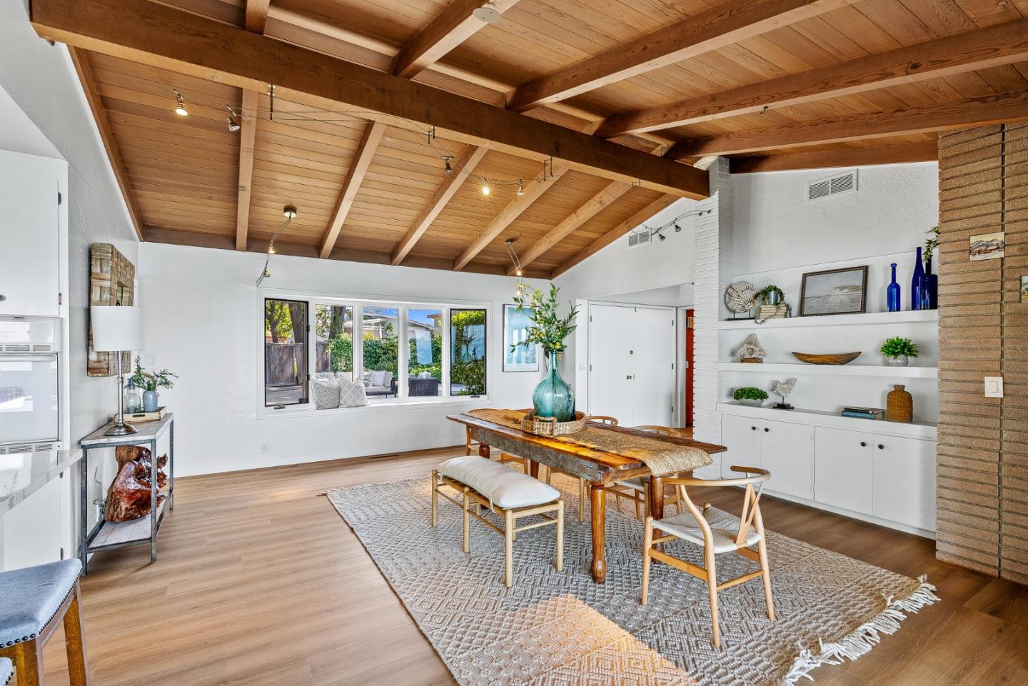 701 Seacliff Drive Aptos, CA 95003 - Photo 14 of 76 a dining room with furniture a chandelier and wooden floor