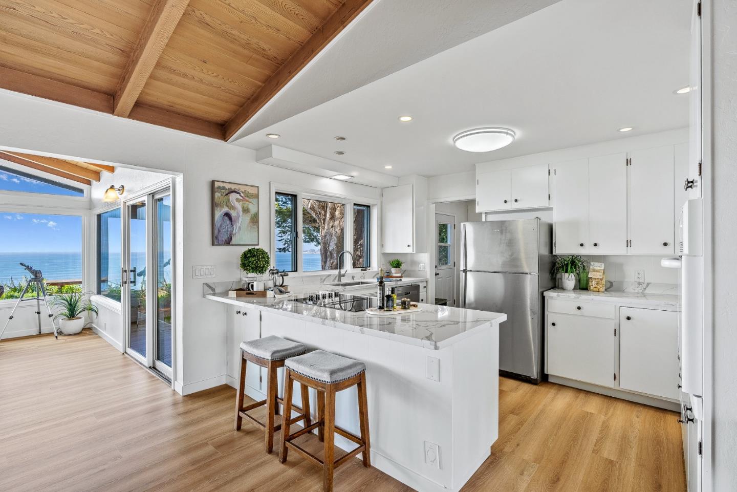 701 Seacliff Drive Aptos, CA 95003 - Photo 20 of 76 a kitchen with refrigerator and white cabinets