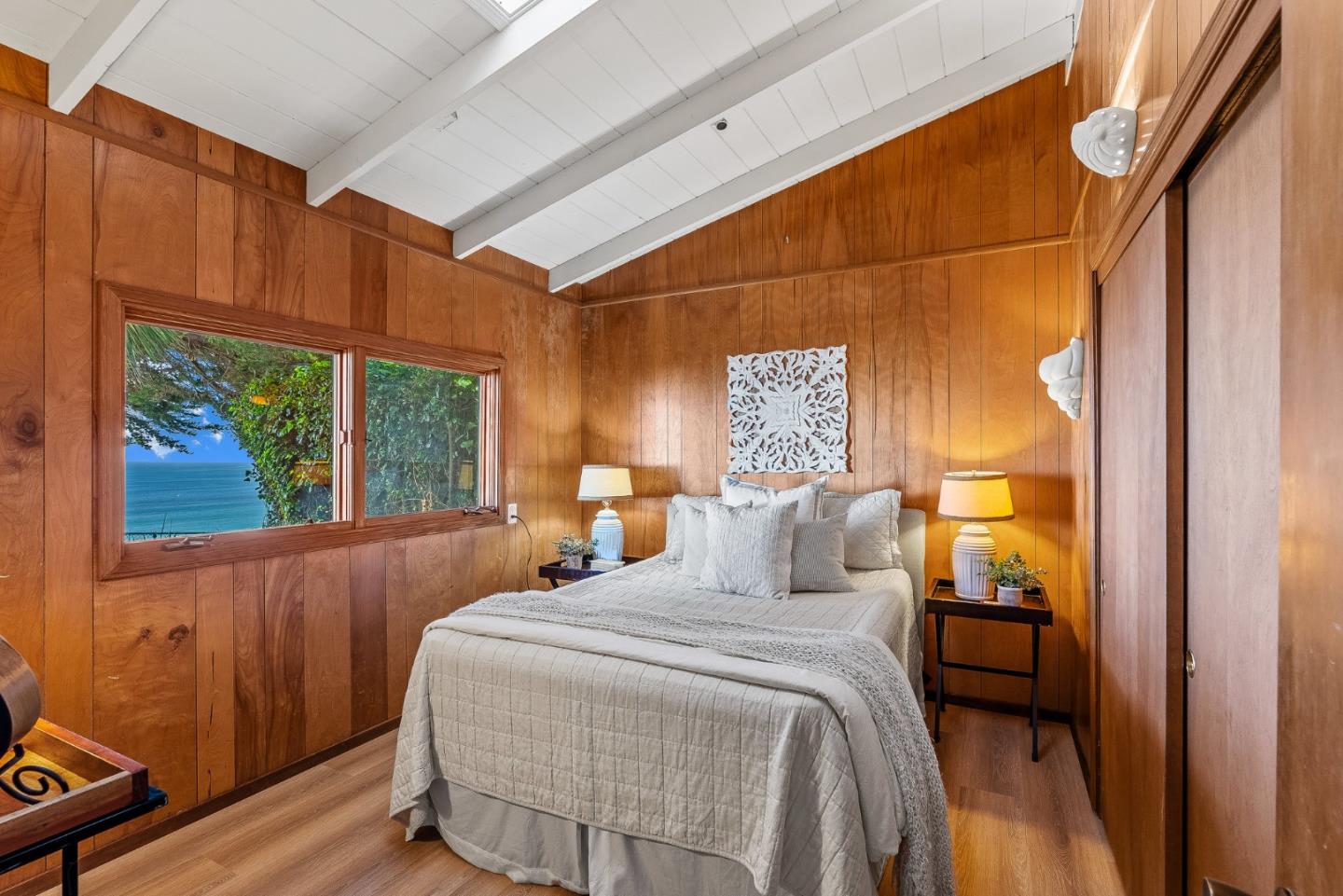701 Seacliff Drive Aptos, CA 95003 - Photo 28 of 76 a bedroom with a bed and a window
