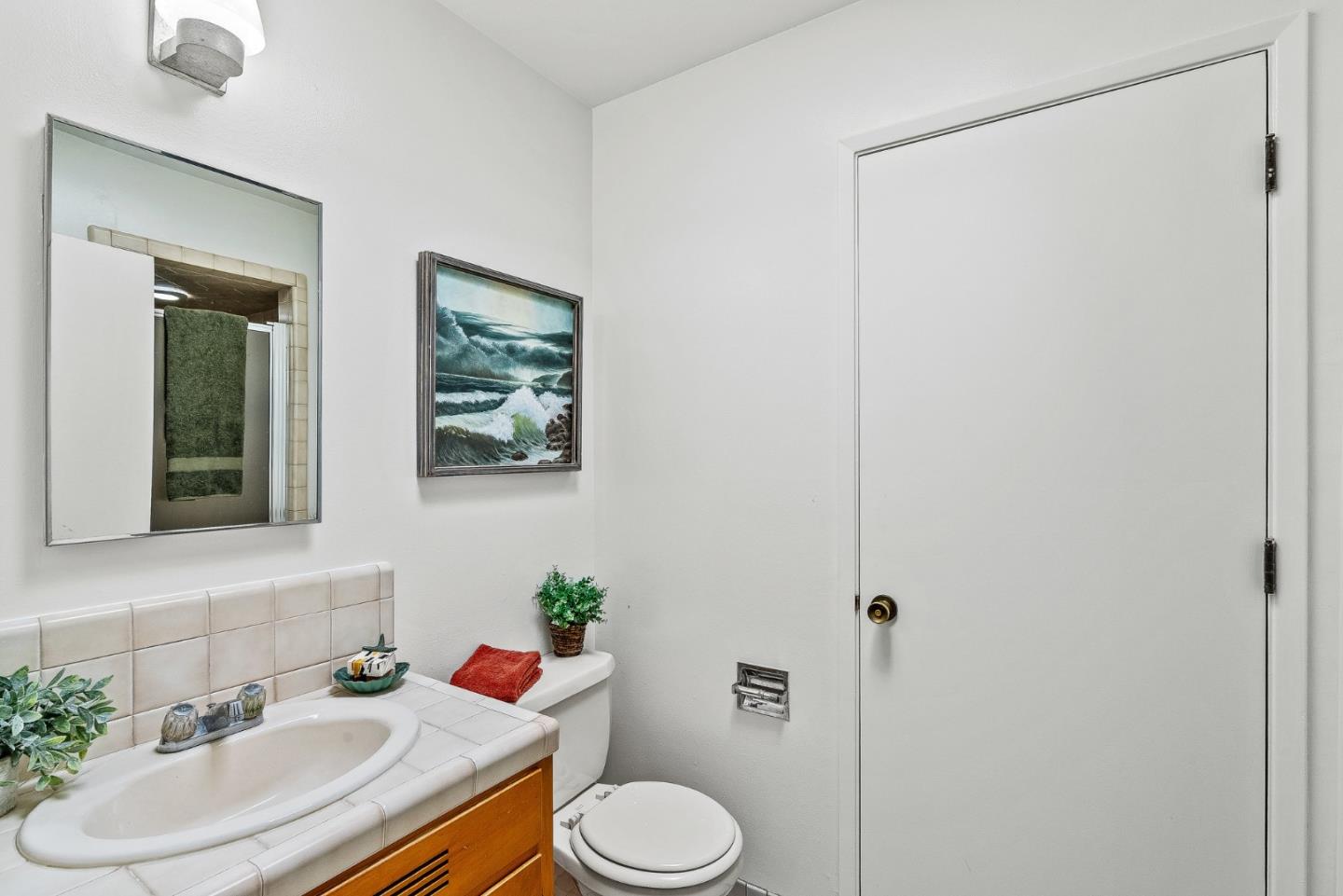 701 Seacliff Drive Aptos, CA 95003 - Photo 30 of 76 a bathroom with a sink toilet and shower