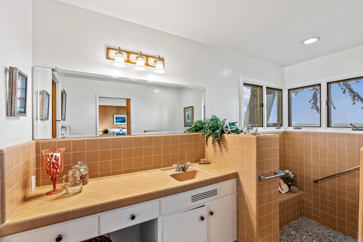 701 Seacliff Drive Aptos, CA 95003 - Photo 35 of 76 a bathroom with a sink and a mirror