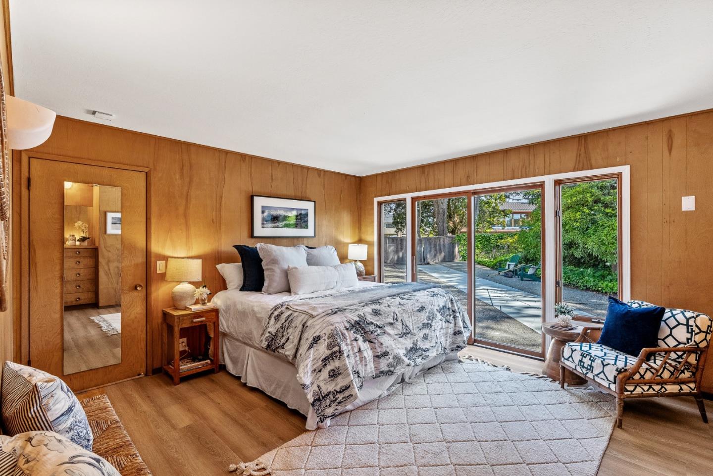 701 Seacliff Drive Aptos, CA 95003 - Photo 37 of 76 a bedroom with a bed and glass walk in closet