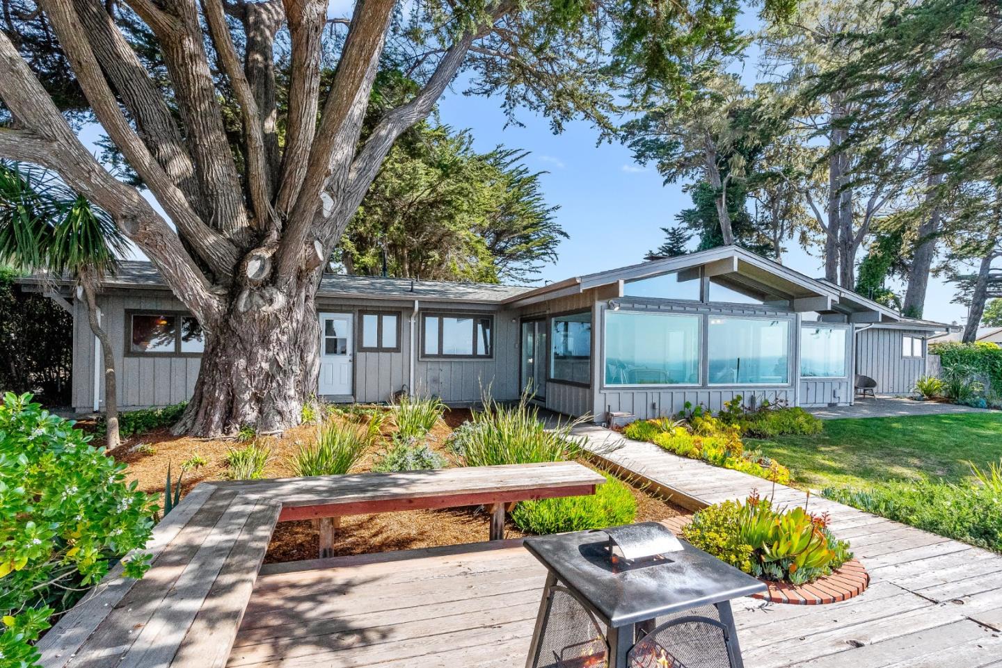701 Seacliff Drive Aptos, CA 95003 - Photo 44 of 76 a front view of a house with a yard table and chairs