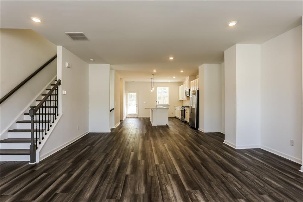 339 Sammon Way Lawrenceville, GA 30046 - Photo 5 of 20 a view of a room with wooden floor