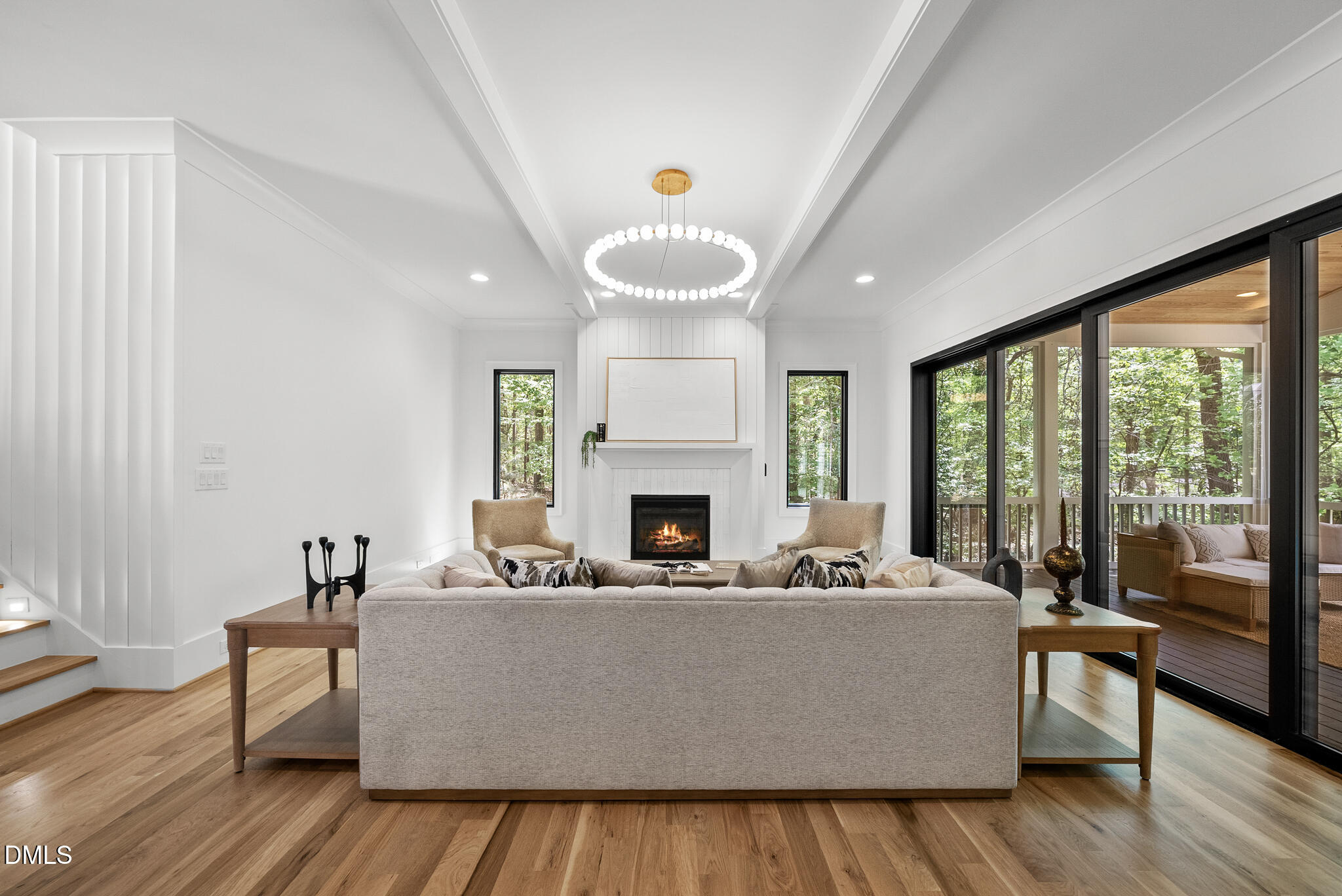 1609 Ridge Road Raleigh, NC 27607 - Photo 7 of 62 a living room with furniture a fireplace and a floor to ceiling window