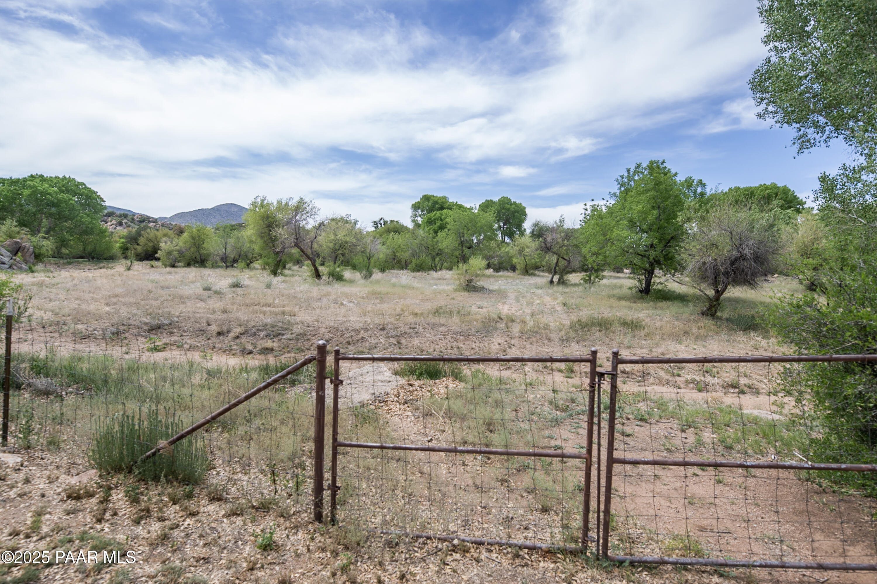 770 Grisby Road Skull Valley, AZ 86338 - Photo 52 of 58 a view of a dry yard with wooden fence