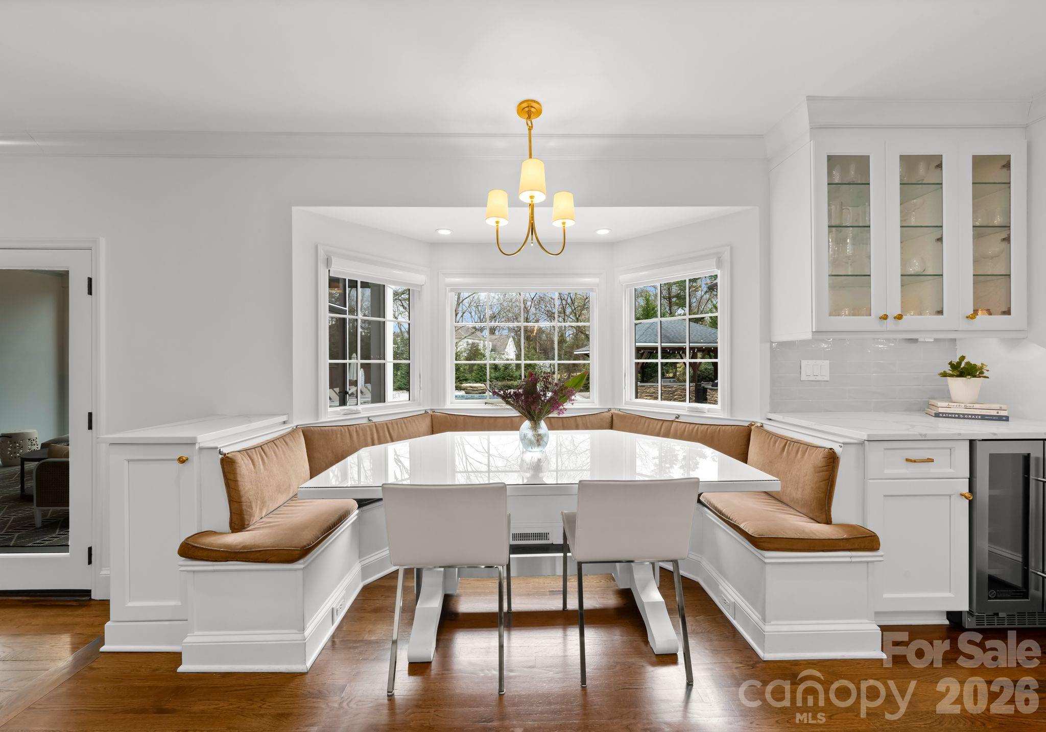 3800 River Ridge Road Charlotte, NC 28226 - Photo 14 of 48 a view of a dining room with furniture a chandelier and wooden floor