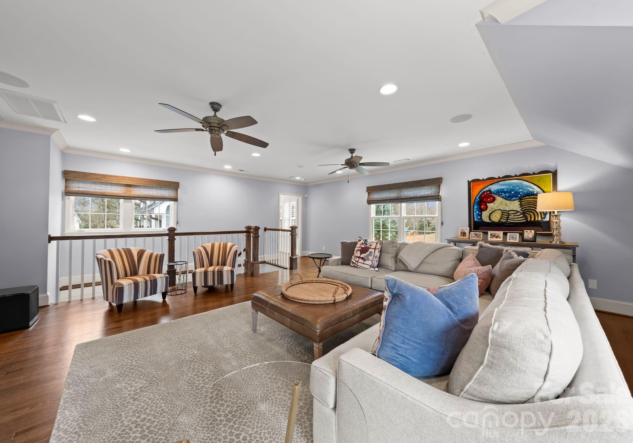 3800 River Ridge Road Charlotte, NC 28226 - Photo 25 of 48 a living room with furniture a ceiling fan and a rug