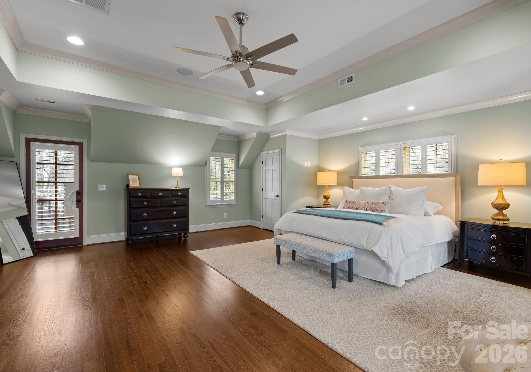 3800 River Ridge Road Charlotte, NC 28226 - Photo 28 of 48 a spacious bedroom with a bed a dresser and wooden floor