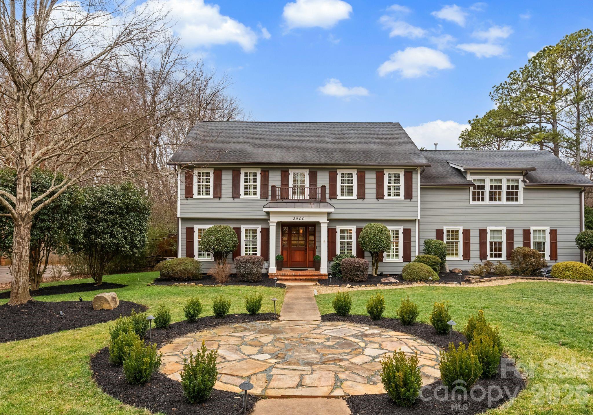 3800 River Ridge Road Charlotte, NC 28226 - Photo 4 of 48 a front view of a house with a yard table and chairs