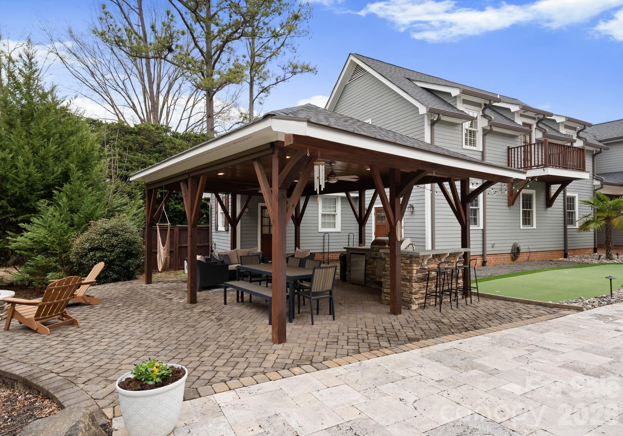 3800 River Ridge Road Charlotte, NC 28226 - Photo 41 of 48 a view of a chair and table in the patio