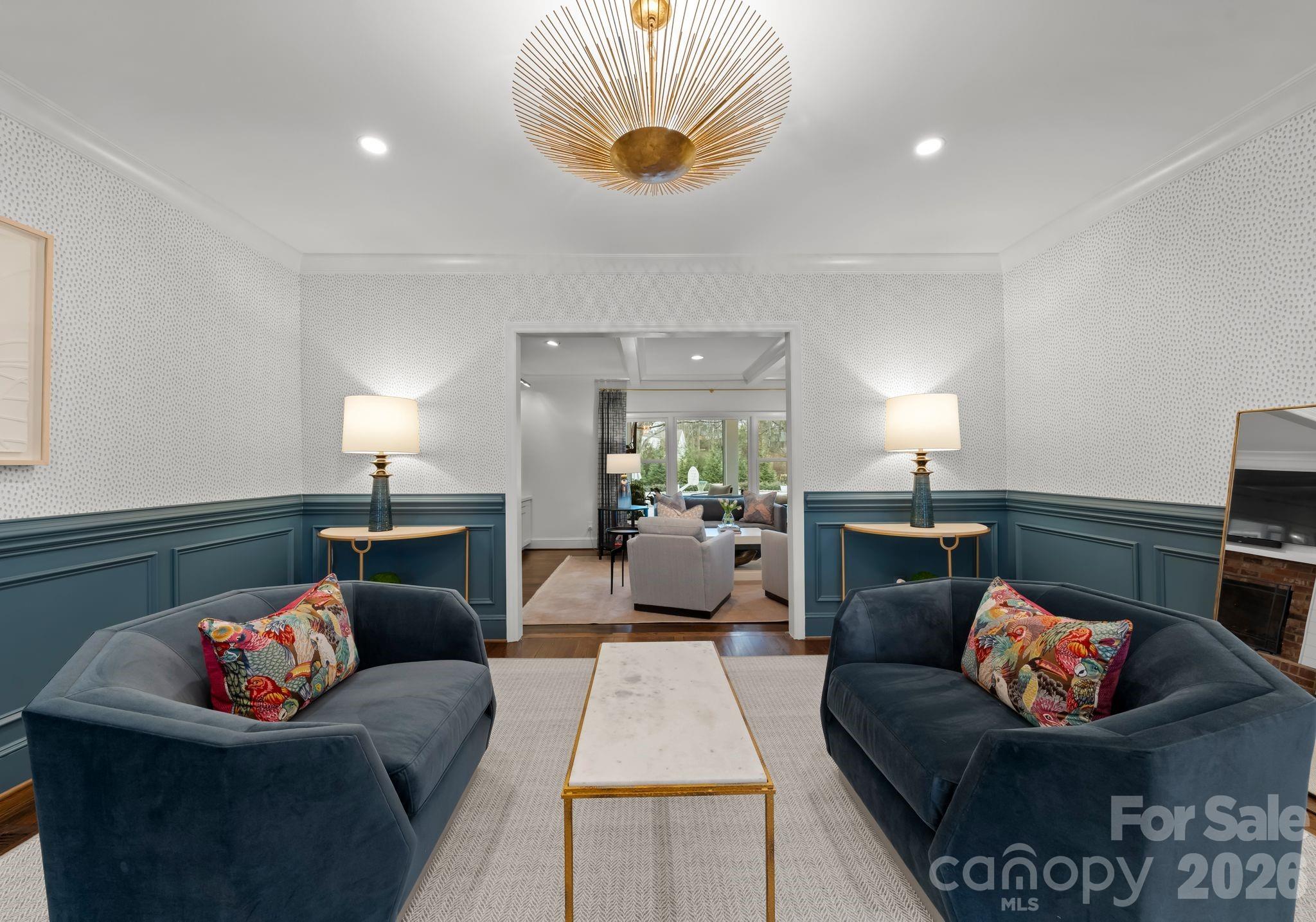 3800 River Ridge Road Charlotte, NC 28226 - Photo 8 of 48 a living room with furniture and a chandelier