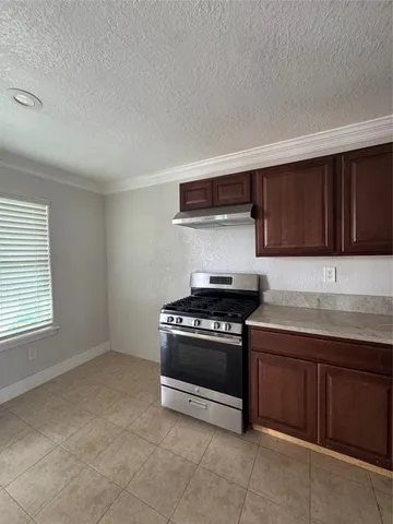 a kitchen with a stove and a sink