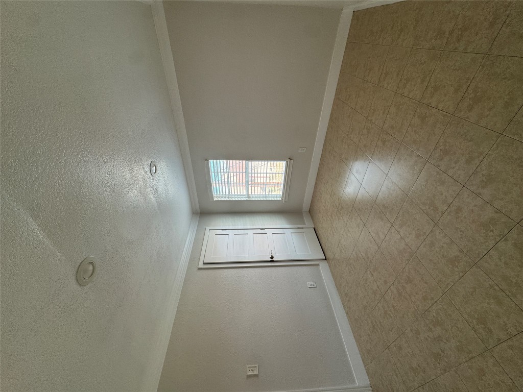 5210 Tahoe Trail, Unit D Austin, TX 78745 - Photo 5 of 10 an empty room with windows