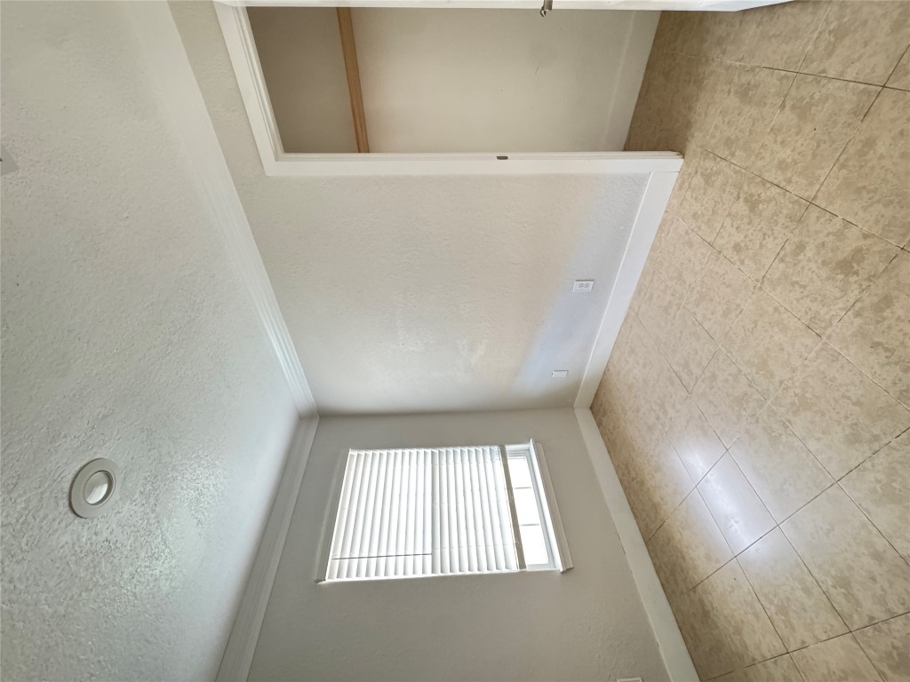 5210 Tahoe Trail, Unit D Austin, TX 78745 - Photo 6 of 10 an empty room with a empty space and windows