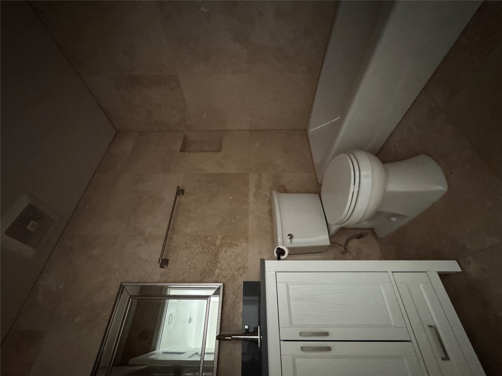 5210 Tahoe Trail, Unit D Austin, TX 78745 - Photo 7 of 10 a bathroom with a toilet a sink and bathtub