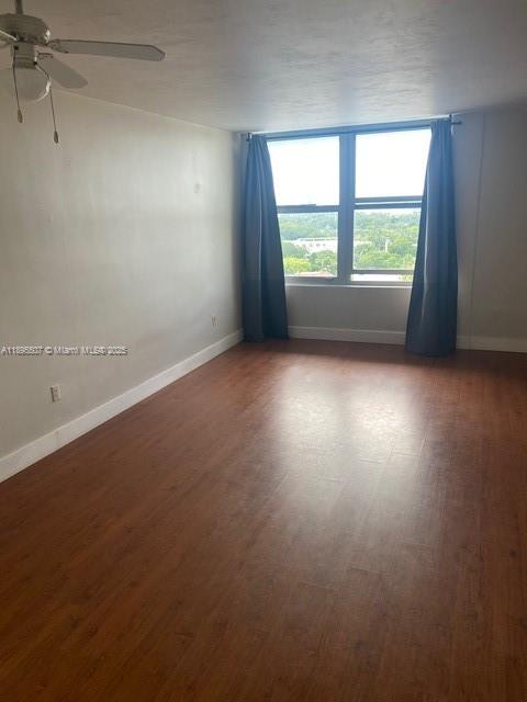 2899 Collins Avenue, Unit 1746 Miami Beach, FL 33140 - Photo 5 of 12 an empty room with windows