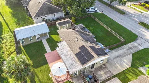 an aerial view of a house with a garden