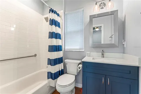 a bathroom with a sink a toilet and a bathtub