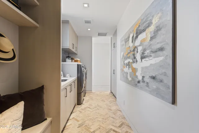 a bathroom with a granite countertop sink a mirror and a shower