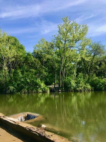 a view of a lake with a yard