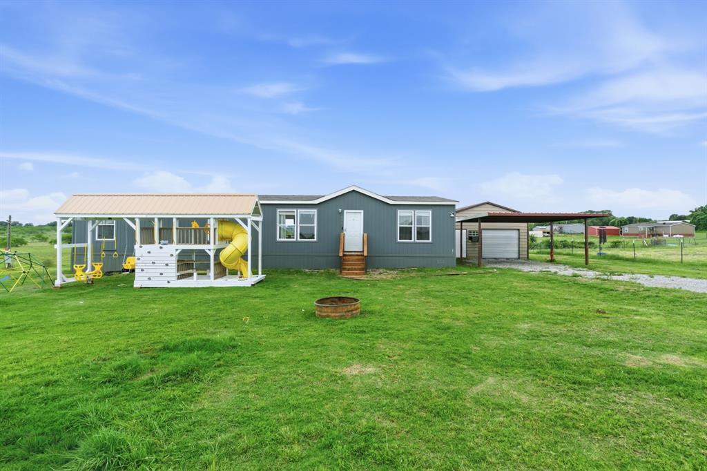 126 Common Way Boyd, TX 76023 - Photo 1 of 19 a view of a house with backyard and garden