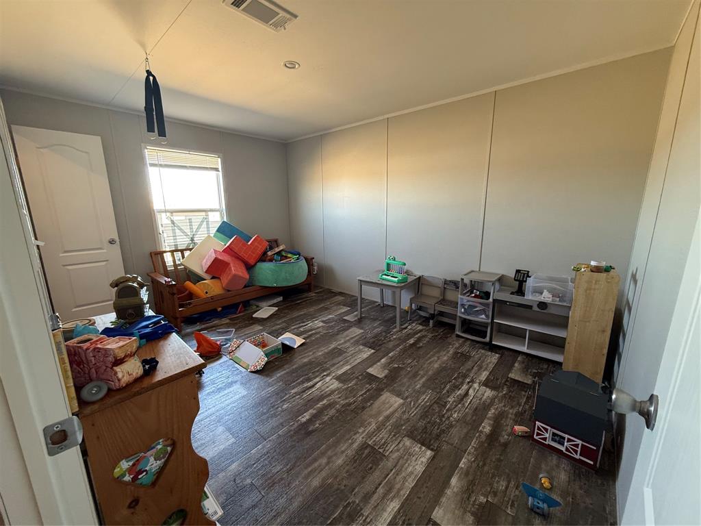 126 Common Way Boyd, TX 76023 - Photo 13 of 14 a living room with furniture and a wooden floor