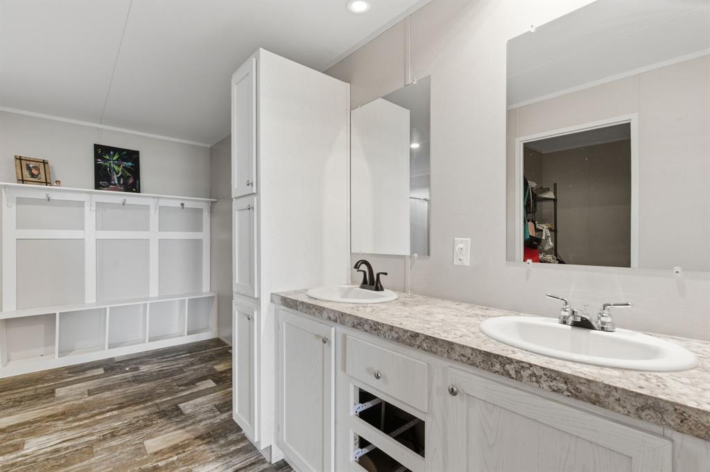 126 Common Way Boyd, TX 76023 - Photo 15 of 19 a bathroom with a granite countertop sink and a mirror