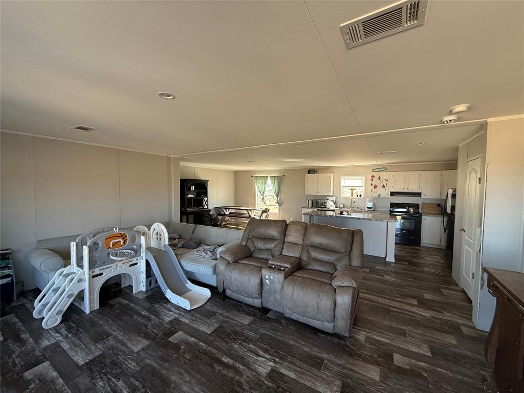 126 Common Way Boyd, TX 76023 - Photo 5 of 14 a living room with furniture and a flat screen tv