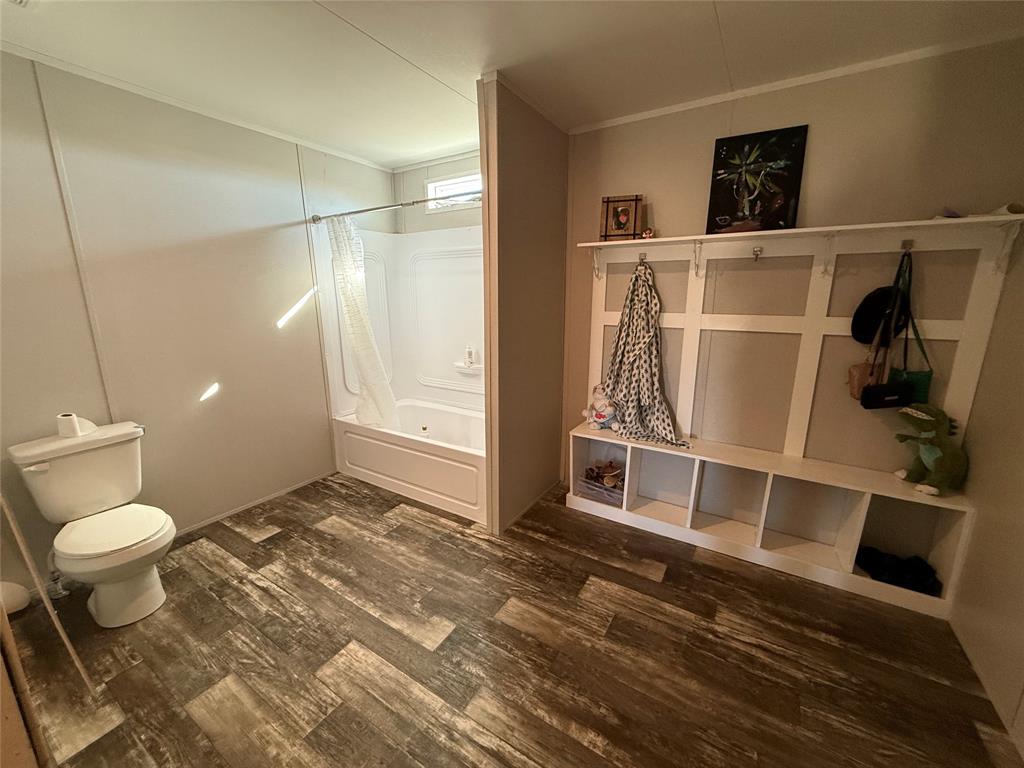 126 Common Way Boyd, TX 76023 - Photo 10 of 14 a bathroom with a toilet and a shower