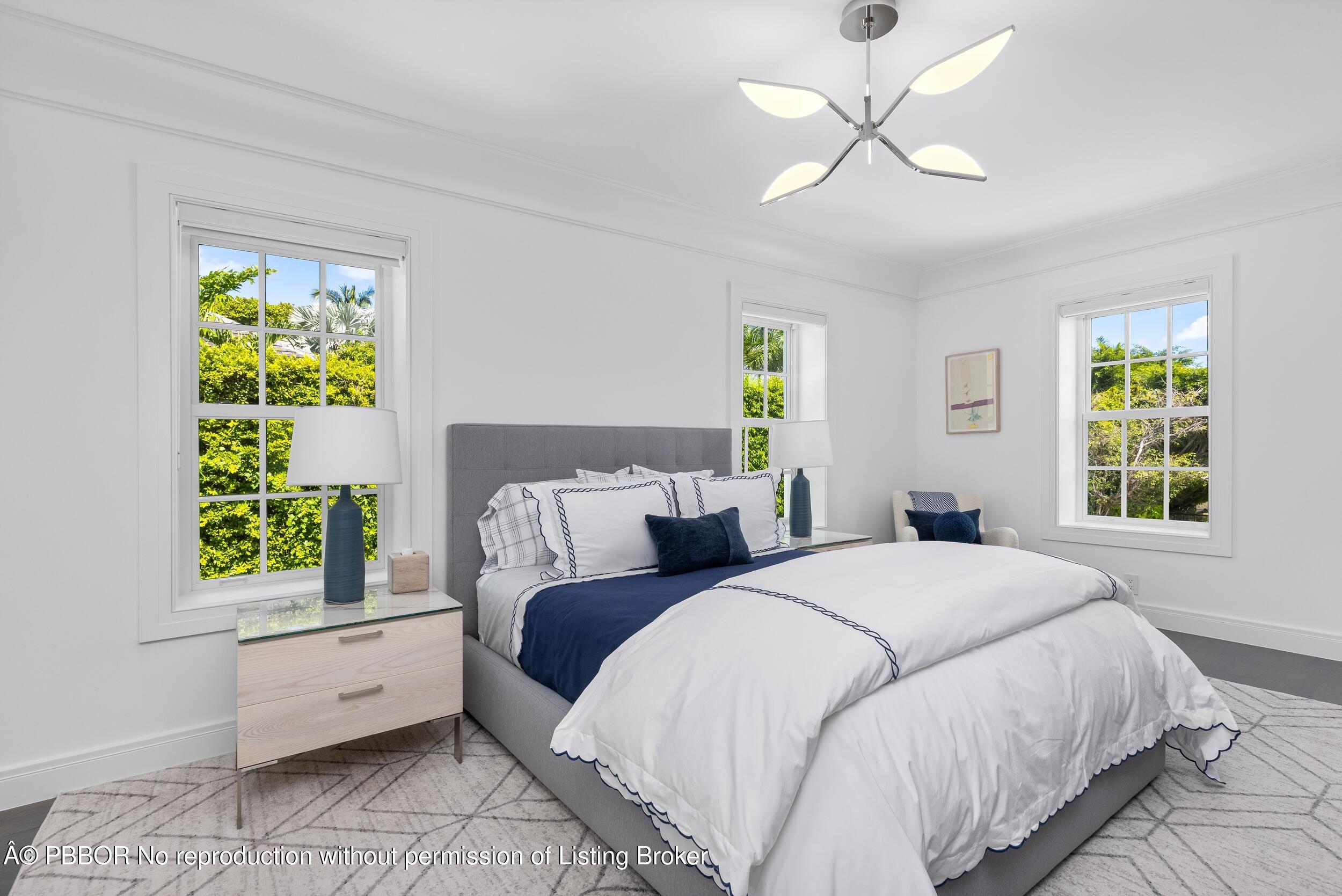 201 Banyan Road Palm Beach, FL 33480 - Photo 22 of 42 a spacious bedroom with a bed and a window