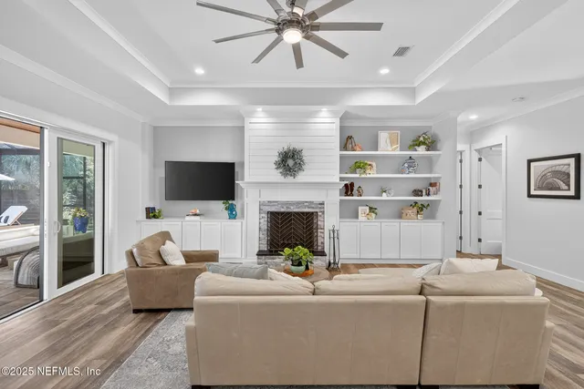 a kitchen with a stove and white cabinets