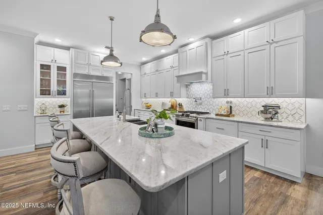 a bathroom with a bathtub and sink