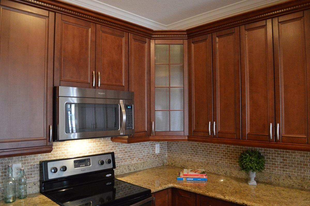 5968 Catesby Street Boca Raton, FL 33433 - Photo 8 of 23 a kitchen with granite countertop a refrigerator stove and cabinets