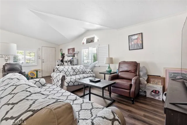 a bedroom with two beds and a dresser