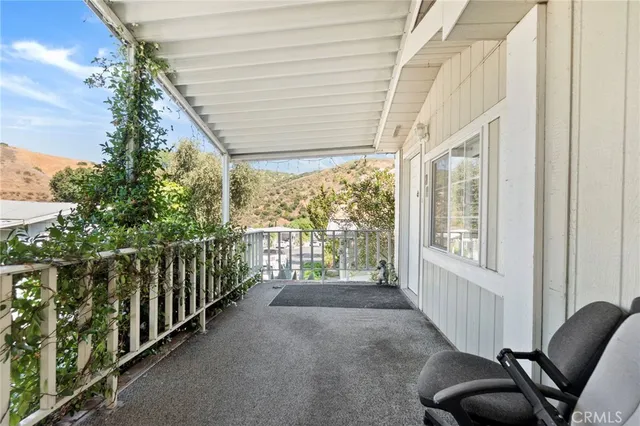 a view of a porch with furniture