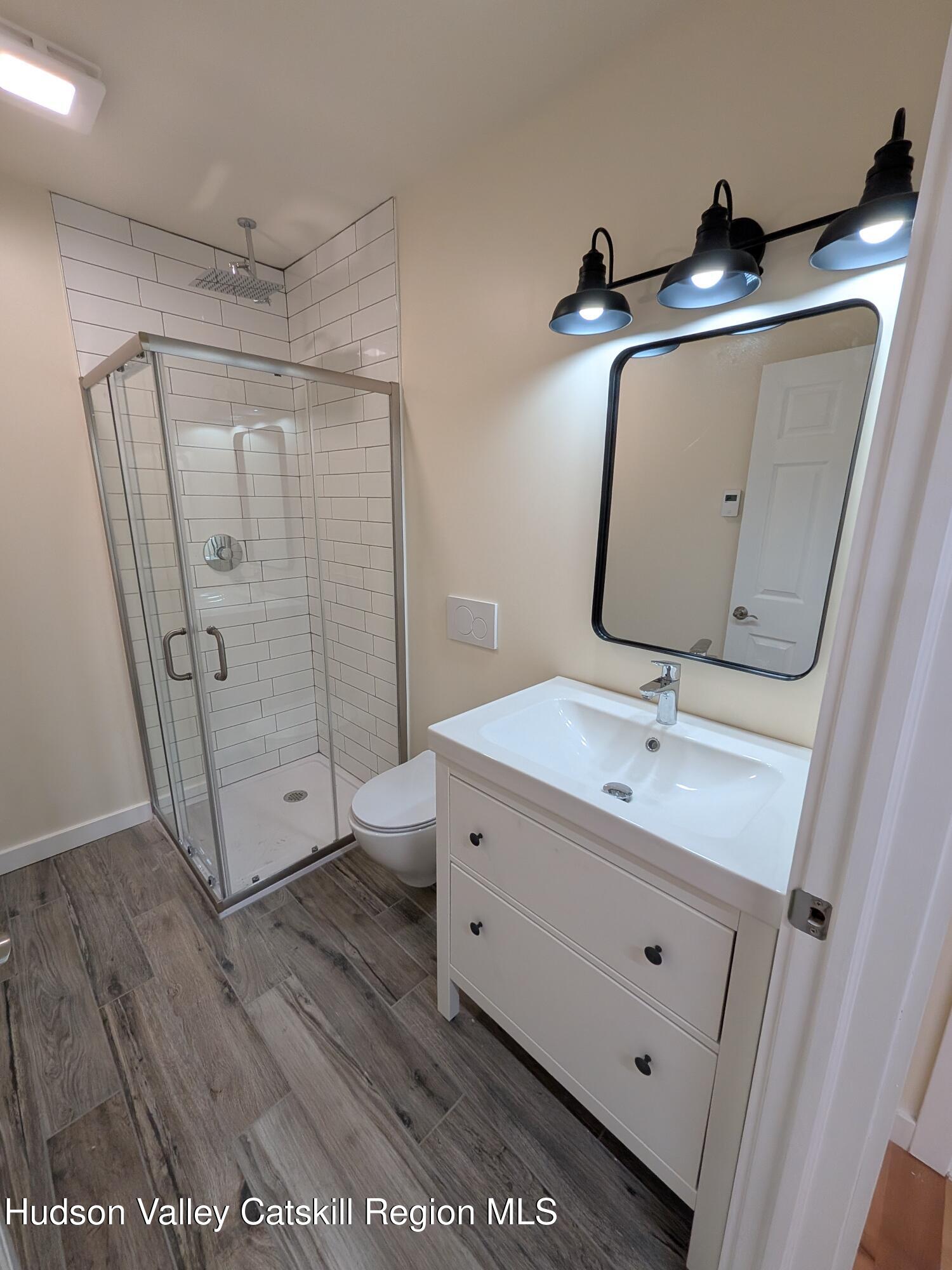 513 South Mountain Road Gardiner, NY 12525 - Photo 47 of 63 a bathroom with a double vanity sink toilet and tub