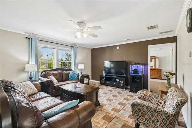 a bedroom with furniture and a wooden floor