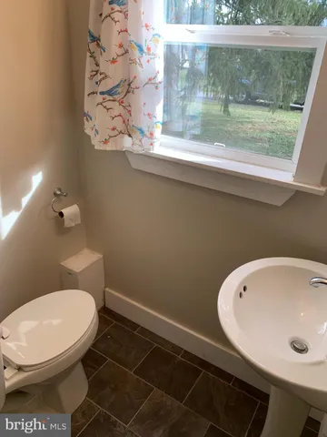 a bathroom with a toilet and a sink